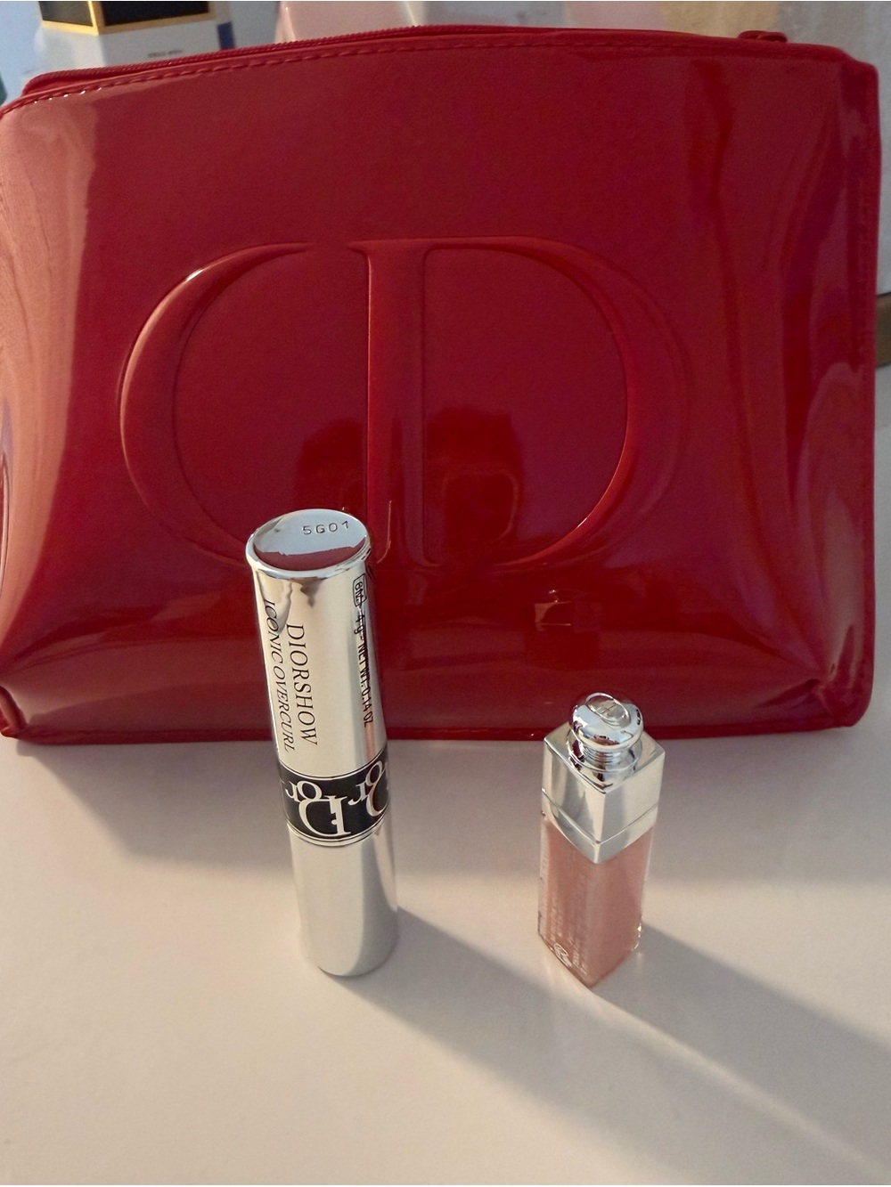 Dior Red Patent Cosmetic Pouch comes with Dior show mascara and lip maximazer
